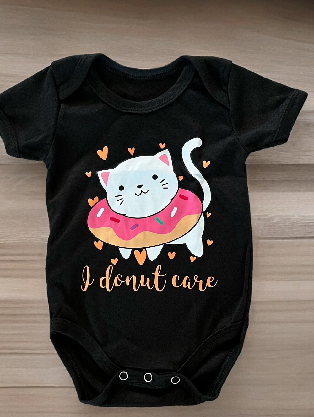 Black Baby Bodysuit with Cute Donut Cat Graphic